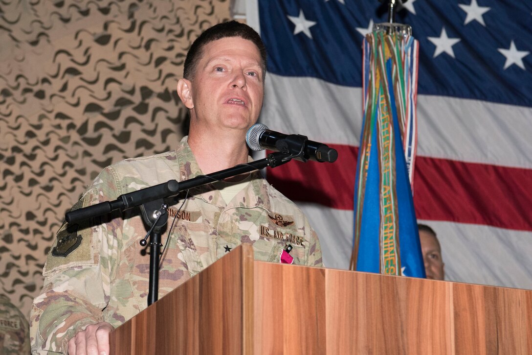 Brig. Gen. Kyle Robinson, former 332nd Air Expeditionary Wing commander, provides a few parting words for the members of the 332nd AEW during his change of command ceremony, June 9, 2018, at an undisclosed location in Southwest Asia.