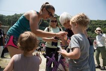 Station residents take to the fields, plant rice