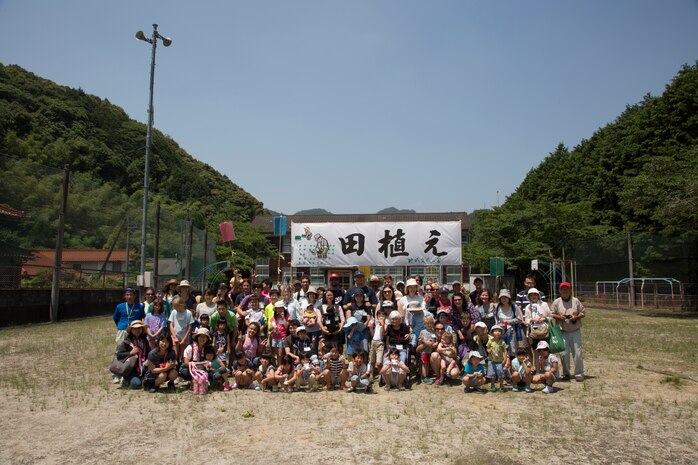 Station residents take to the fields, plant rice