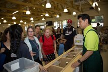 Station residents take to the fields, plant rice