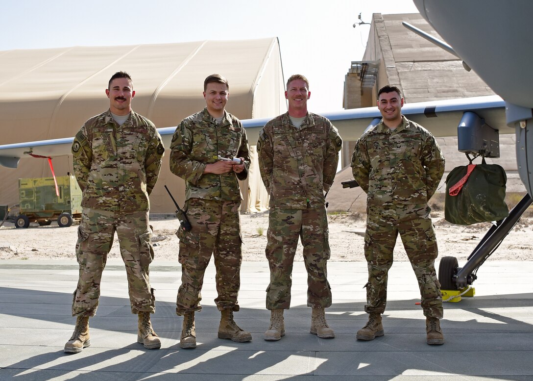 Staff Sgt. Hermann Nunez, 386th Expeditionary Aircraft Maintenance Squadron, Senior Airman Alex Young, 386th Expeditionary Maintenance Squadron, Tech. Sgt. Chance Cole, 386th EAMXS and Senior Airman Elio Esqueda, 386th EMXS, recently teamed up to create the ‘Spline Insert Extractor.’ (U.S. Air Force photo by Staff Sgt. Christopher Stoltz)