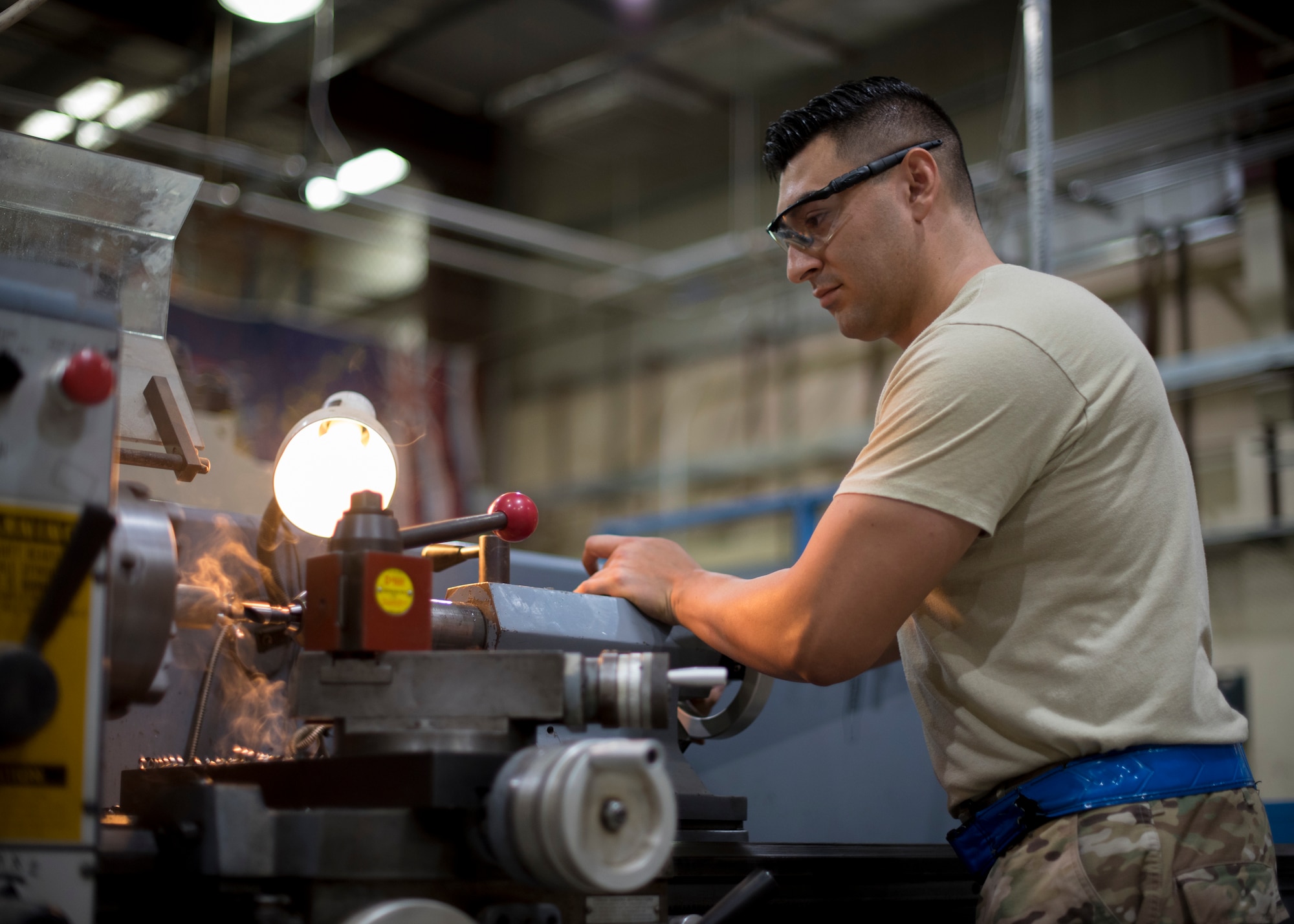 Senior Airman Elio Esqueda, 386th Expeditionary Maintenance Squadron aircraft metals technician, uses a lathe to create a ‘Spline Insert Extractor,’ May 16, 2018, at an undisclosed location in Southwest Asia. The prototype tool, originally created by Tech. Sgt. Chance Cole and Staff Sgt. Hermann Nunez, 386th Air Expeditionary Aircraft Maintenance Squadron, will save the Air Force a lot of money. (U.S. Air Force photo by Staff Sgt. Christopher Stoltz)