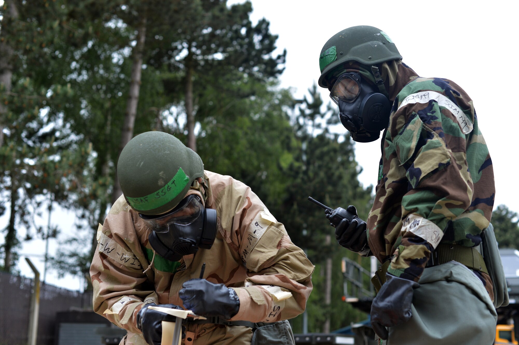 48th Fighter Wing Airmen conduct post-attack reconnaissance during a readiness exercise at Royal Air Force Lakenheath, England, June 5, 2018. Exercise training emphasized a broad spectrum of elements from pre-attack preparedness, command and control, and protection of assets and personnel, to post-attack reconnaissance and self-aid buddy care for wounded wingmen. (U.S. Air Force photo by Master Sgt. Eric Burks) (Portions of this image have been obscured to protect operational security)
