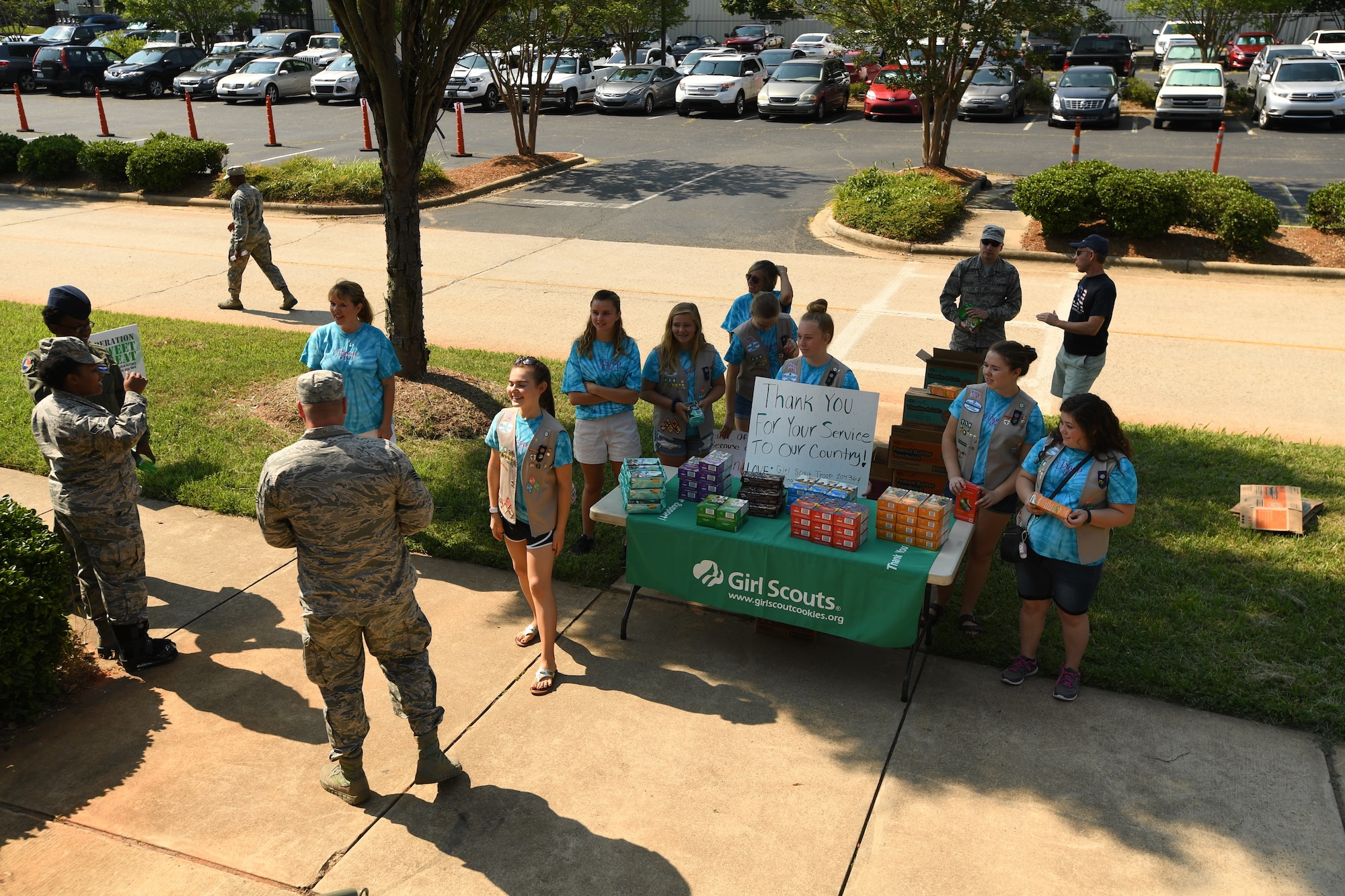 U.S. Air Force Airmen stopped by to pick out their favorite box of Girl Scout cookies from Troop 20436 of Denver, N.C., during the fifth annual visit to the North Carolina Air National Guard Base, Charlotte Douglas International Airport, June 9, 2018. Seven Girl Scouts showed appreciation for the military members as they handed out 600 boxes of cookies to Airmen.