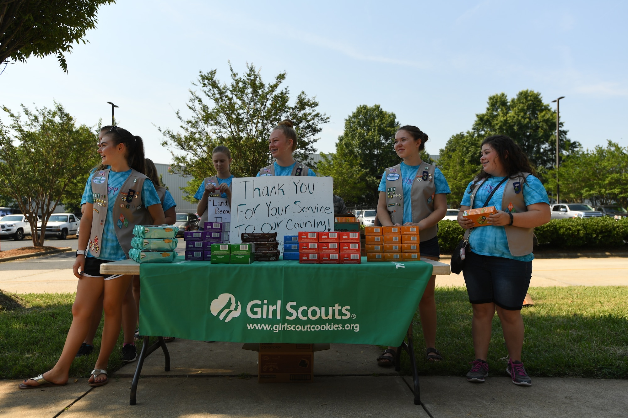 Girl Scouts from Troop 20436 of Denver, N.C., are ready to hand out cookies to Airmen during the fifth annual visit to the North Carolina Air National Guard Base, Charlotte Douglas International Airport, June 9, 2018. This is part of a council-wide service project, called Operation Sweet Treat, where Girl Scouts collect cookies to give to U.S. military members serving in the United States and deployed overseas.