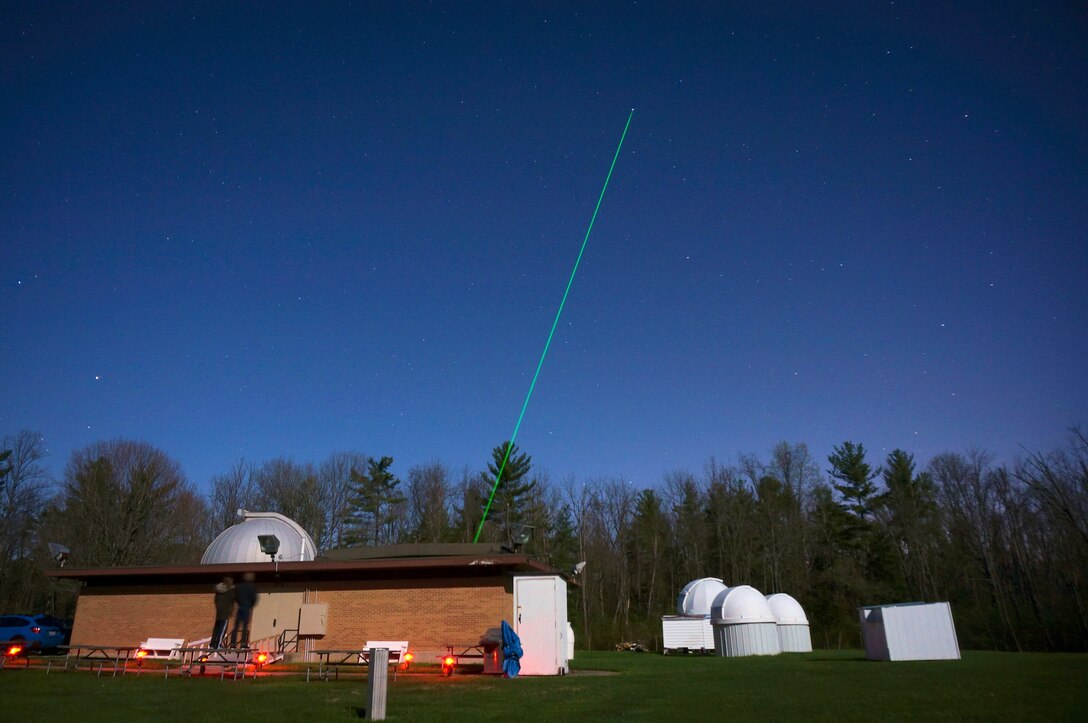 The Turbulence and Aerosol Research Dynamic Interrogation System, or TARDIS, laser is fired into the night sky above the John Bryan State Park observatory April 29, 2018. Scientists from the Electro-Optical Space Situational Awareness Team at the Air Force Research Laboratory Sensors Directorate then analyze data returned by reflected light to study turbulence in the atmosphere, thereby allowing for a better capability of imaging objects in space. (U.S. Air Force photo/Dan LeMaster)