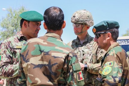 Master Sgt. Lou Spinazze, senior enlisted leader for the Police Advising Team for Train, Advise and Assist Command-South, talks with Afghan senior enlisted leaders, May 25, 2018, during a meeting at the Regional Military Training Center-Kandahar.