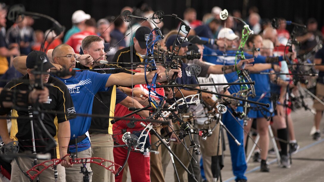 Wounded Warrior athletes compete in an archery event.