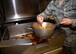 Senior Airman Jeremy Dwyer, 56th Force Support Squadron services supervisor, glazes chicken at the Hensman Dining Facility June 8, 2018 at Luke Air Force Base, Ariz.