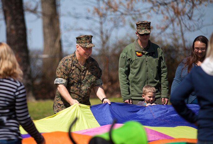 During the event there were activities for the whole family, food and an opportunity to create a human ribbon to recognize the Purple Ribbon Campaign, supporting Domestic Violence Awareness month. (Official USMC Photos by Sgt. Ryan M. Heintzelman)