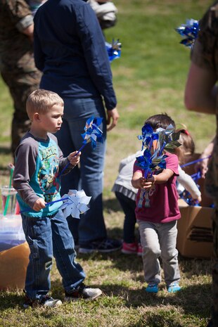 During the event there were activities for the whole family, food and an opportunity to create a human ribbon to recognize the Purple Ribbon Campaign, supporting Domestic Violence Awareness month. (Official USMC Photos by Sgt. Ryan M. Heintzelman)