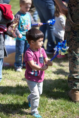 During the event there were activities for the whole family, food and an opportunity to create a human ribbon to recognize the Purple Ribbon Campaign, supporting Domestic Violence Awareness month. (Official USMC Photos by Sgt. Ryan M. Heintzelman)