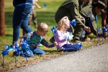 During the event there were activities for the whole family, food and an opportunity to create a human ribbon to recognize the Purple Ribbon Campaign, supporting Domestic Violence Awareness month. (Official USMC Photos by Sgt. Ryan M. Heintzelman)