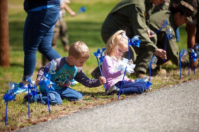 During the event there were activities for the whole family, food and an opportunity to create a human ribbon to recognize the Purple Ribbon Campaign, supporting Domestic Violence Awareness month. (Official USMC Photos by Sgt. Ryan M. Heintzelman)