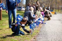 During the event there were activities for the whole family, food and an opportunity to create a human ribbon to recognize the Purple Ribbon Campaign, supporting Domestic Violence Awareness month. (Official USMC Photos by Sgt. Ryan M. Heintzelman)