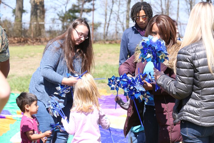 Chemical Biological Incident Response Force family readiness team, with the assistance of Marine Corps Community Services Henderson Hall, hosted a “Healthy Relationships” family day event aboard Naval Support Facility Indian Head, Md., April 17, 2018. During the event there were activities for the whole family, food and an opportunity to create a human ribbon to recognize the Purple Ribbon Campaign, supporting Domestic Violence Awareness month. (Official USMC Photos by Staff Sgt. Santiago G. Colon Jr.)