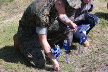 Chemical Biological Incident Response Force family readiness team, with the assistance of Marine Corps Community Services Henderson Hall, hosted a “Healthy Relationships” family day event aboard Naval Support Facility Indian Head, Md., April 17, 2018. During the event there were activities for the whole family, food and an opportunity to create a human ribbon to recognize the Purple Ribbon Campaign, supporting Domestic Violence Awareness month. (Official USMC Photos by Staff Sgt. Santiago G. Colon Jr.)