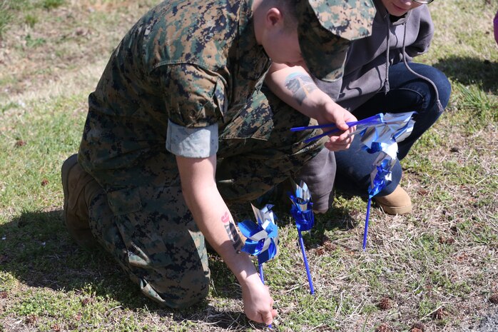 Chemical Biological Incident Response Force family readiness team, with the assistance of Marine Corps Community Services Henderson Hall, hosted a “Healthy Relationships” family day event aboard Naval Support Facility Indian Head, Md., April 17, 2018. During the event there were activities for the whole family, food and an opportunity to create a human ribbon to recognize the Purple Ribbon Campaign, supporting Domestic Violence Awareness month. (Official USMC Photos by Staff Sgt. Santiago G. Colon Jr.)