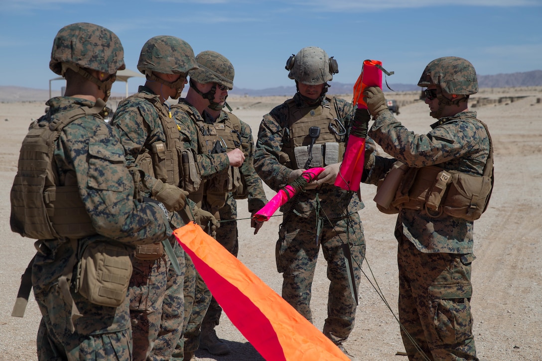 U.S. Marines with Mike Battery, 3rd Battalion, 14th Marine Regiment, set up a casualty evacuation site at a crew-served weapons range exercise during Integrated Training Exercise 4-18 at Marine Corps Air Ground Combat Center Twentynine Palms, California, June 10, 2018. ITX 4-18 provides MAGTF elements an opportunity to undergo a service-level assessment of core competencies that are essential to expeditionary, forward-deployed operations. (U.S. Marine Corps photo by Lance Cpl. Samantha Schwoch/released)