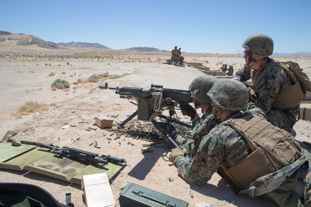U.S. Marines with Mike Battery, 3rd Battalion, 14th Marine Regiment, train with M240B medium machine guns at a crew-served weapons range exercise during Integrated Training Exercise 4-18 at Marine Corps Air Ground Combat Center Twentynine Palms, California, June 10, 2018. ITX 4-18 provides MAGTF elements an opportunity to undergo a service-level assessment of core competencies that are essential to expeditionary, forward-deployed operations. (U.S. Marine Corps photo by Lance Cpl. Samantha Schwoch/released)