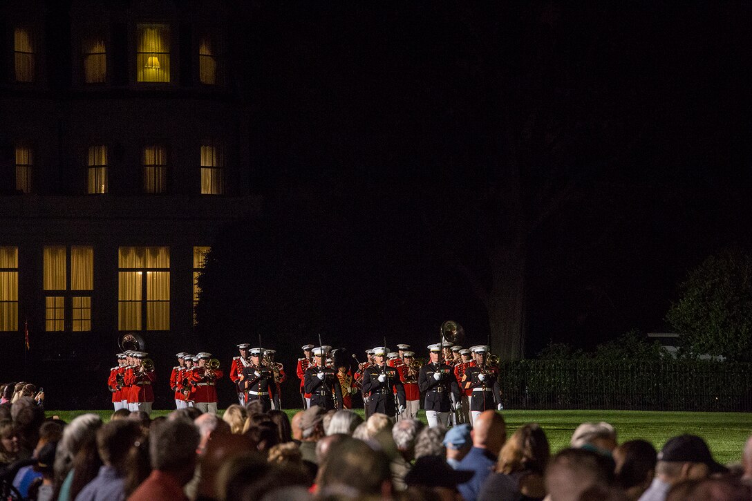 The Marine Barracks Washington D.C. parade marching staff executes “eyes right” during the Friday Evening Parade at the Barracks, June 8, 2018. The hosting official for the parade was U.S. Marine Corps Lt. Gen. Frank McKenzie, director, Joint Staff, and the guests of honor were U.S. Army Lt. Gen. Joseph Anderson, deputy chief of staff for the Army; U.S. Marine Corps Lt. Gen. Brian Beaudreault, deputy commandant, plans, policies and operation; U.S. Navy Vice Adm. Andrew Lewis, deputy chief of operations for operations, plans and strategy; and U.S. Air Force Lt. Gen. Mark C. Nowland, deputy chief of staff for operations. (Official Marine Corps photo by Sgt. Robert Knapp/Released)