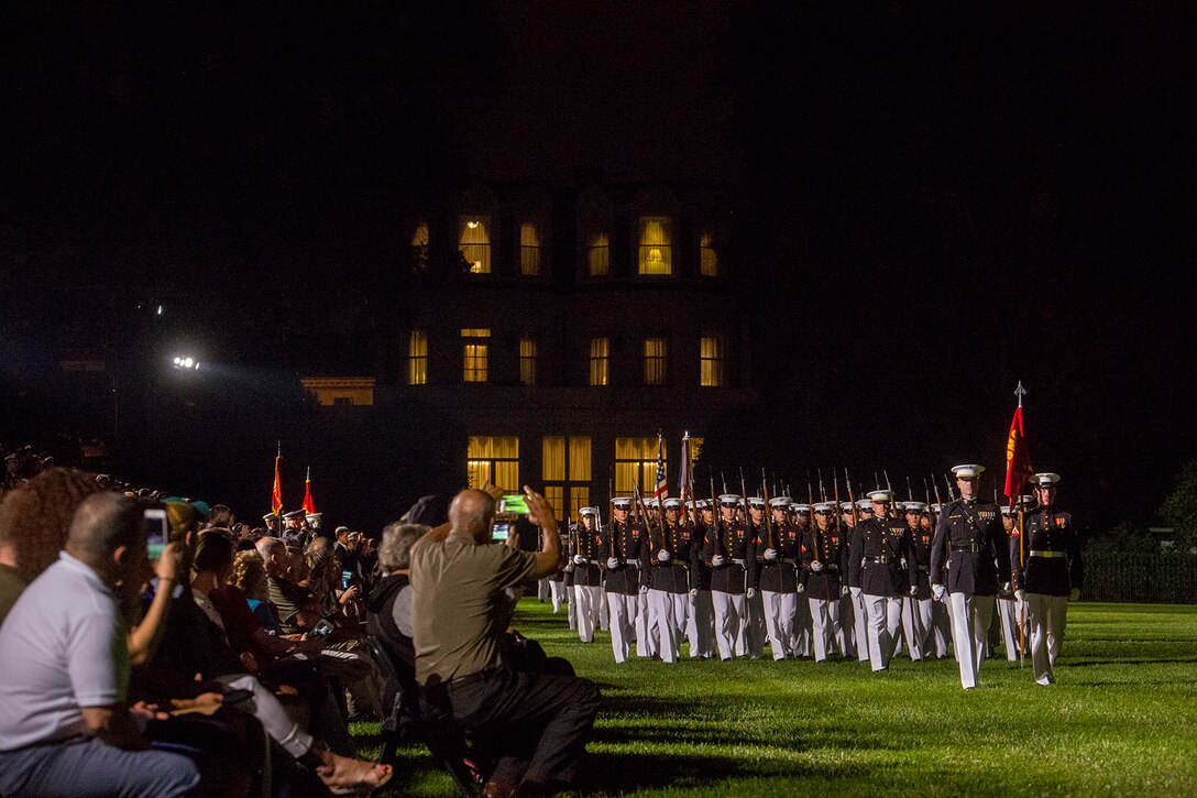 Marines with Alpha Company, Marine Barracks Washington D.C., march across the parade deck during the Friday Evening Parade at the Barracks, June 8, 2018. The hosting official for the parade was U.S. Marine Corps Lt. Gen. Frank McKenzie, director, Joint Staff, and the guests of honor were U.S. Army Lt. Gen. Joseph Anderson, deputy chief of staff for the Army; U.S. Marine Corps Lt. Gen. Brian Beaudreault, deputy commandant, plans, policies and operation; U.S. Navy Vice Adm. Andrew Lewis, deputy chief of operations for operations, plans and strategy; and U.S. Air Force Lt. Gen. Mark C. Nowland, deputy chief of staff for operations. (Official Marine Corps photo by Sgt. Robert Knapp/Released)