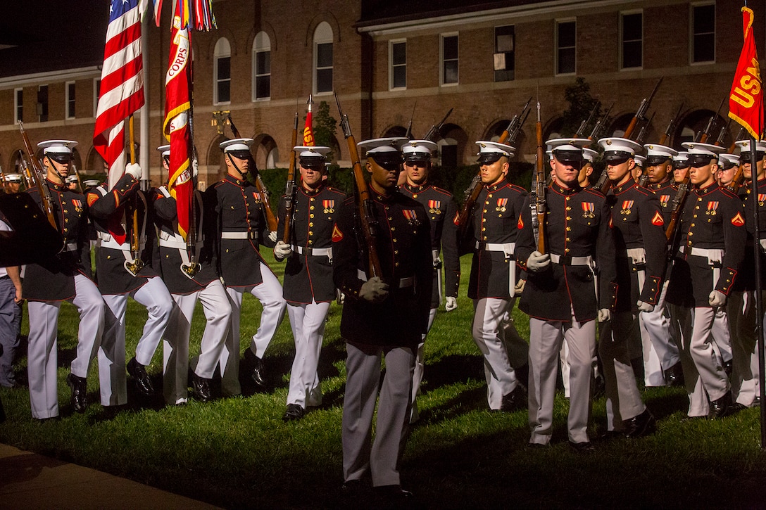 Marines with Alpha Company, Marine Barracks Washington D.C., march across the parade deck during the Friday Evening Parade at the Barracks, June 8, 2018.