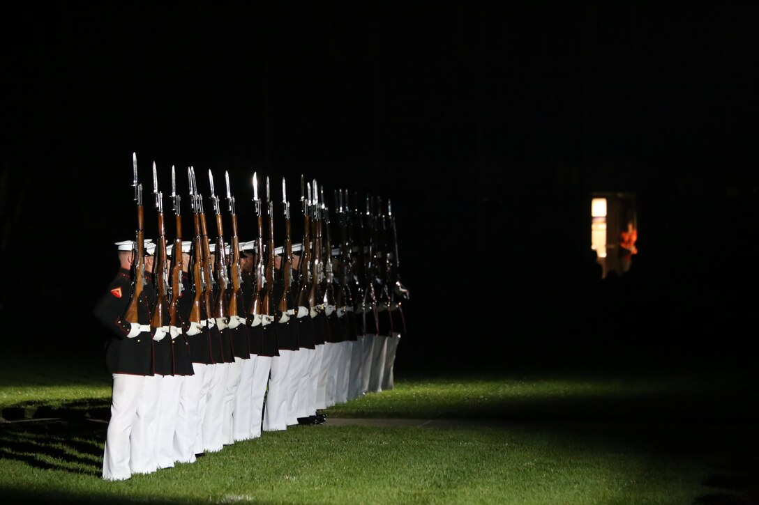 Marines with the U.S. Marine Corps Silent Drill Platoon stand at “steep right” during the Friday Evening Parade at Marine Barracks Washington D.C., June 8, 2018. The hosting official for the parade was U.S. Marine Corps Lt. Gen. Frank McKenzie, director, Joint Staff, and the guests of honor were U.S. Army Lt. Gen. Joseph Anderson, deputy chief of staff for the Army; U.S. Marine Corps Lt. Gen. Brian Beaudreault, deputy commandant, plans, policies and operation; U.S. Navy Vice Adm. Andrew Lewis, deputy chief of operations for operations, plans and strategy; and U.S. Air Force Lt. Gen. Mark C. Nowland, deputy chief of staff for operations.
