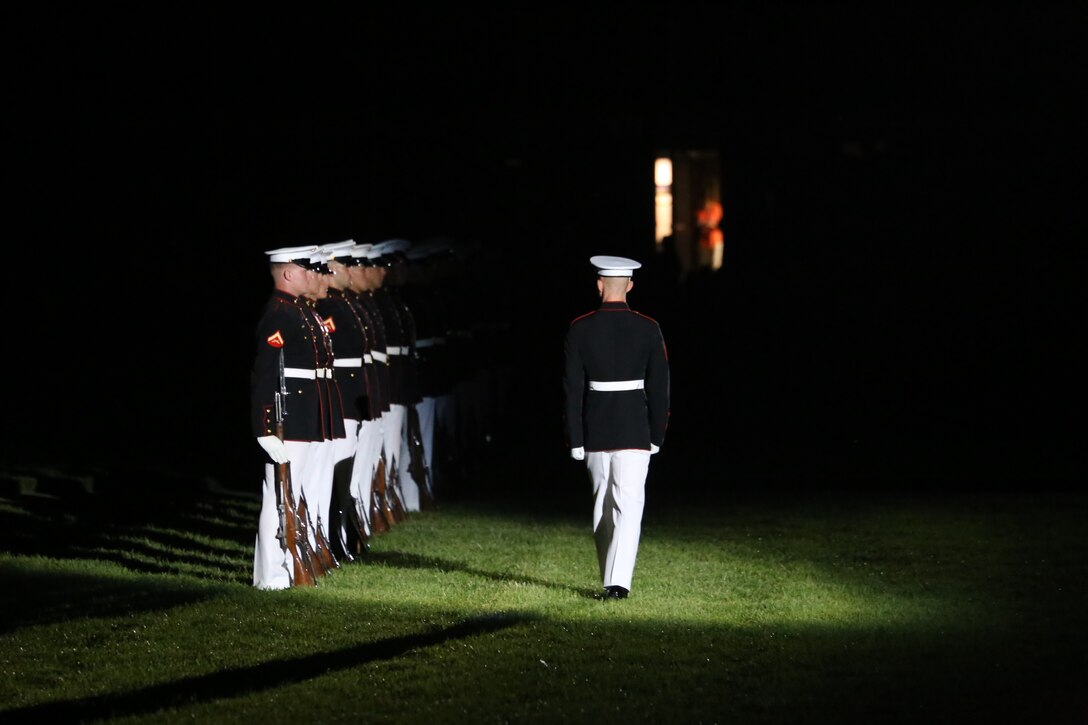 Corporal Ryan Watkins, rifle inspector, U.S. Marine Corps Silent Drill Platoon, prepares to execute a rifle inspection during the Friday Evening Parade at Marine Barracks Washington D.C., June 8, 2018. The hosting official for the parade was U.S. Marine Corps Lt. Gen. Frank McKenzie, director, Joint Staff, and the guests of honor were U.S. Army Lt. Gen. Joseph Anderson, deputy chief of staff for the Army; U.S. Marine Corps Lt. Gen. Brian Beaudreault, deputy commandant, plans, policies and operation; U.S. Navy Vice Adm. Andrew Lewis, deputy chief of operations for operations, plans and strategy; and U.S. Air Force Lt. Gen. Mark C. Nowland, deputy chief of staff for operations.