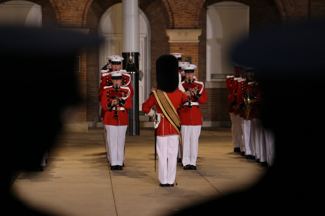 Gunnery Sgt. Stacie Crowther, assistant drum major, “The President’s Own” U.S. Marine Band, conducts the band on Center Walk during the Friday Evening Parade at Marine Barracks Washington D.C., June 8, 2018. The hosting official for the parade was U.S. Marine Corps Lt. Gen. Frank McKenzie, director, Joint Staff, and the guests of honor were U.S. Army Lt. Gen. Joseph Anderson, deputy chief of staff for the Army; U.S. Marine Corps Lt. Gen. Brian Beaudreault, deputy commandant, plans, policies and operation; U.S. Navy Vice Adm. Andrew Lewis, deputy chief of operations for operations, plans and strategy; and U.S. Air Force Lt. Gen. Mark C. Nowland, deputy chief of staff for operations.