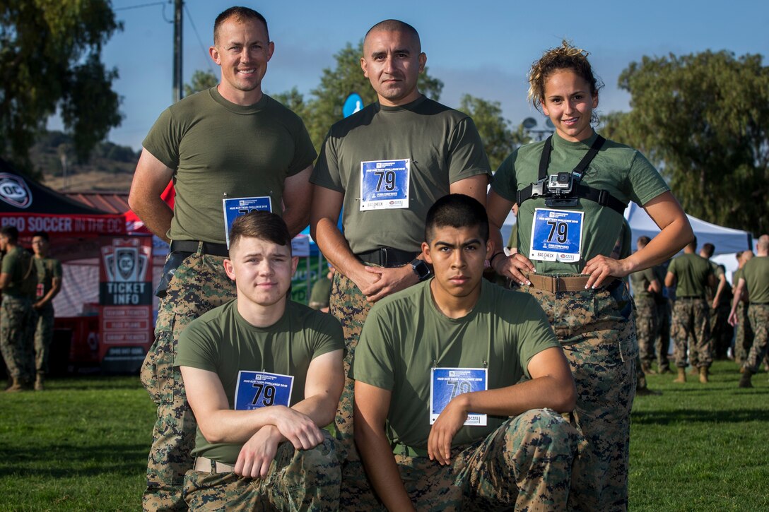 Marines with Headquarters and Support Battalion., Marine Corps Installations - West, pose for a group photo prior to the 2018 Mud Run Commanding General’s Cup Team Competition on Marine Corps Base Camp Pendleton, Calif., June 8, 2018. The race stretched over 10-kilometers around Lake O’Neill on MCB Camp Pendleton. Over 2,000 Marines from numerous units around California and neighboring states participated in the challenge. (U.S. Marine Corps photo by Cpl. Juan C. Bustos)