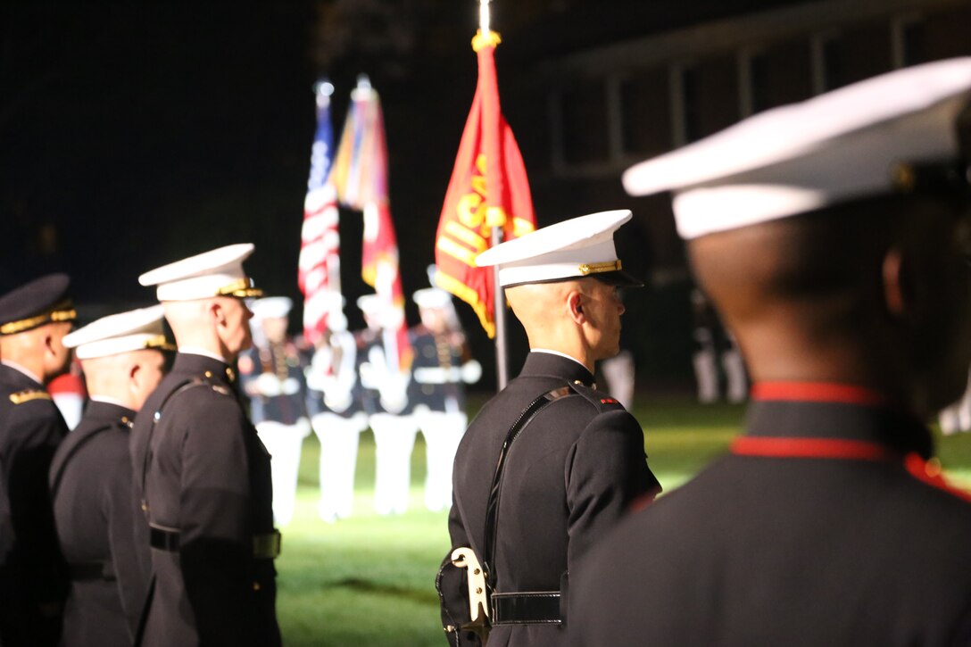 Marines with the U.S. Marine Corps Color Guard march across the parade deck during the Friday Evening Parade at Marine Barracks Washington D.C., June 8, 2018. The hosting official for the parade was U.S. Marine Corps Lt. Gen. Frank McKenzie, director, Joint Staff, and the guests of honor were U.S. Army Lt. Gen. Joseph Anderson, deputy chief of staff for the Army; U.S. Marine Corps Lt. Gen. Brian Beaudreault, deputy commandant, plans, policies and operation; U.S. Navy Vice Adm. Andrew Lewis, deputy chief of operations for operations, plans and strategy; and U.S. Air Force Lt. Gen. Mark C. Nowland, deputy chief of staff for operations.