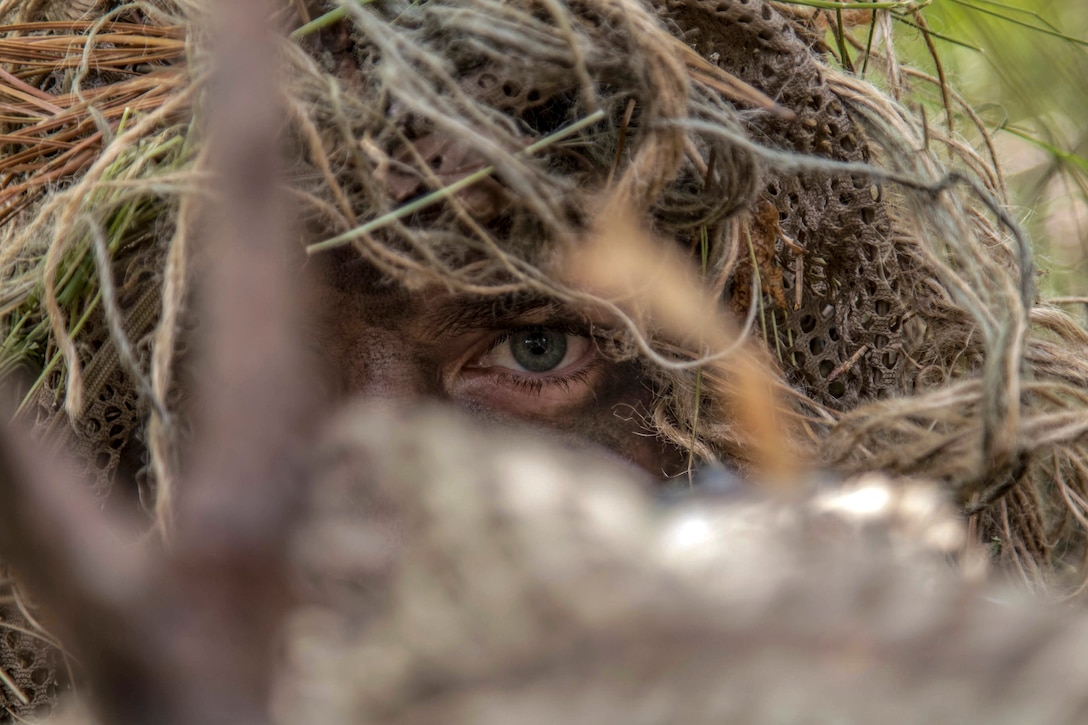 An Army Special Forces stalks a target during a reconnaissance and surveillance exercise.