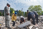 Soldiers from the West Virginia National Guard’s Joint Interagency Training and Education Center teamed up with the Charleston Fire Department search and extraction team June 8, 201,8 at a Charleston Area Medical Center (CAMC) property in the midst of being demolished to conduct real-life search and extraction training. JITEC Search and Rescue instructors joined the fire fighters to sharpen their skills as instructors and bring their training experiences back to the Guard to enhance first responder capabilities.