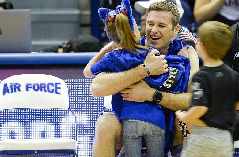Team Air Force athlete Capt. Hunter Barnhill receives a hug from his children after winning silver in the rowing competition during the Department of Defense Warrior Games at the U.S. Air Force Academy, Colorado Springs, Colo., June 9, 2018. Approximately 300 wounded, ill and injured service members and veterans participated in the Games. Competing athletes represented the U.S. Air Force, Army, Marine Corps, Navy, and Special Operations Command, as well as the U.K. Armed Forces, Australian Defence Force and Canadian Armed Forces. (U.S. Air Force photo by Tech Sgt. Anthony Nelson Jr.)