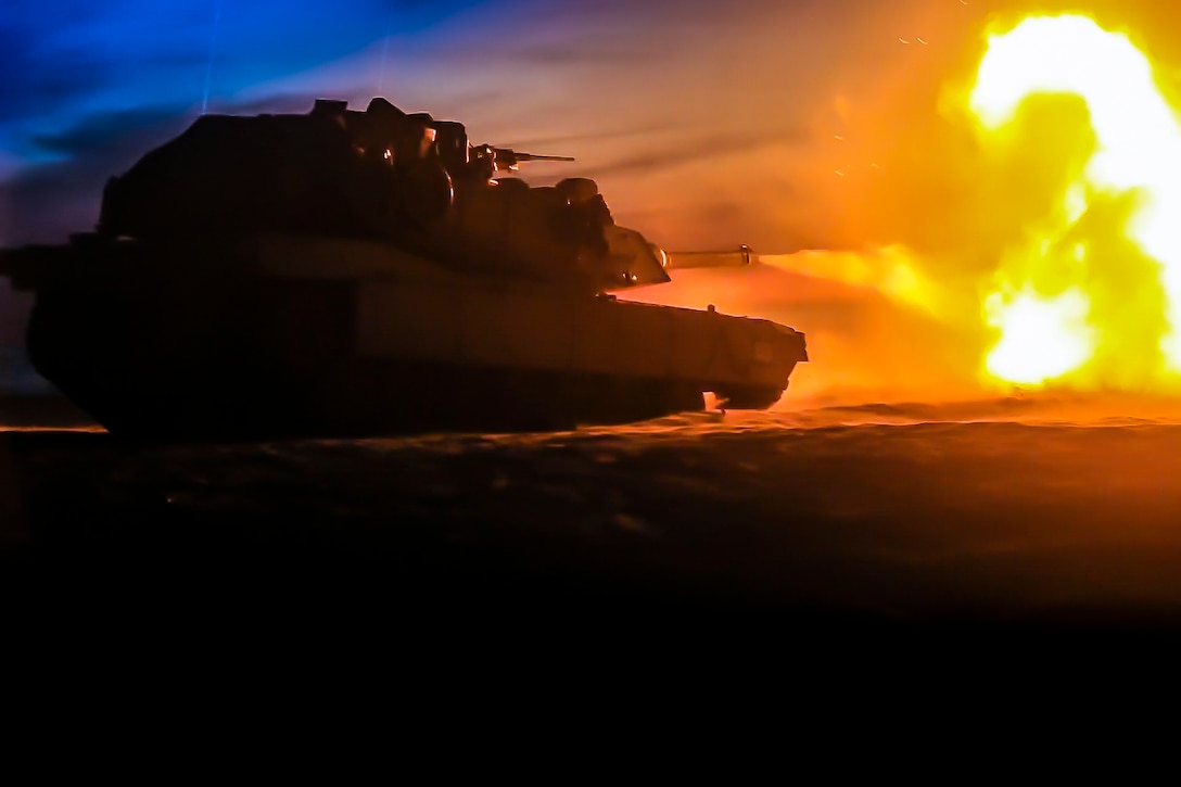 A U.S. Marine Corps M1A1 Abrams tank attached to Tank Platoon, Fox Company, Battalion Landing Team, 2nd Battalion, 6th Marine Regiment, 26th Marine Expeditionary Unit, engage targets at night during live-fire training as part of exercise Baltic Operations 2018 at Ustka, Poland, June 8, 2018. BALTOPS is the premier annual maritime-focused exercise in the Baltic region and one of the largest exercises in Northern Europe enhancing flexibility and interoperability among allied and partner nations.