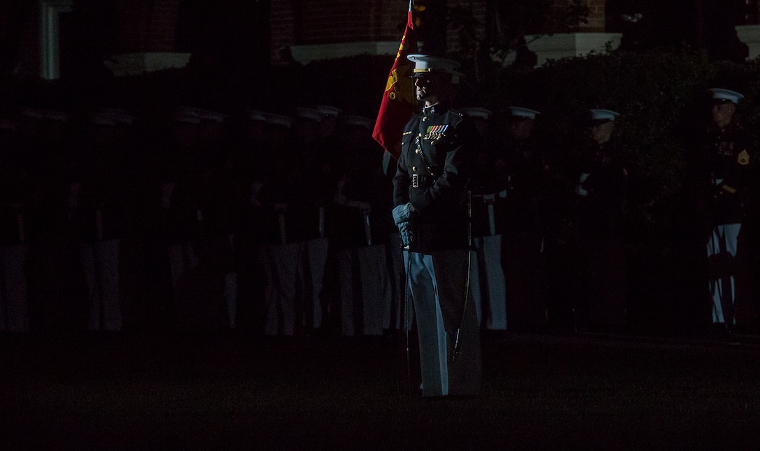 Captain Billy Grissom, company commander, Alpha Company, Marine Barracks Washington D.C., stands at a ceremonial position during the Friday Evening Parade at the Barracks, June 8, 2018. The hosting official for the parade was U.S. Marine Corps Lt. Gen. Frank McKenzie, director, Joint Staff, and the guests of honor were U.S. Army Lt. Gen. Joseph Anderson, deputy chief of staff for the Army; U.S. Marine Corps Lt. Gen. Brian Beaudreault, deputy commandant, plans, policies and operation; U.S. Navy Vice Adm. Andrew Lewis, deputy chief of operations for operations, plans and strategy; and U.S. Air Force Lt. Gen. Mark C. Nowland, deputy chief of staff for operations.