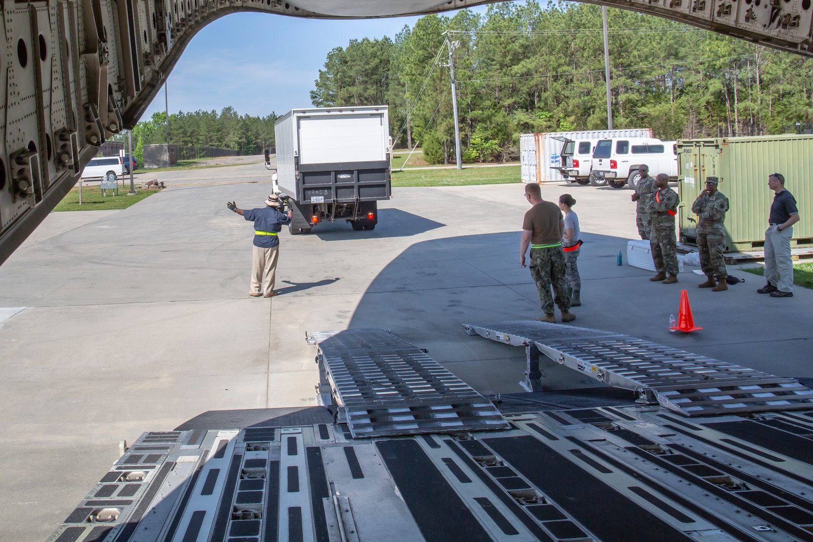 Members of Joint Task Force Civil Support (JTF-CS) participate in a two-day training exercise loading and unloading vehicles on a modified Boeing C-17 Globemaster III. The exercise helped members build the confidence and skills necessary to safely and successfully deploy. JTF-CS provides command and control for designated Department of Defense specialized response forces to assist local, state, federal and tribal partners in saving lives, preventing further injury, and providing critical support to enable community recovery. (Official Department of Defense photo by Mass Communication Specialist 3rd Class Michael Redd/released)