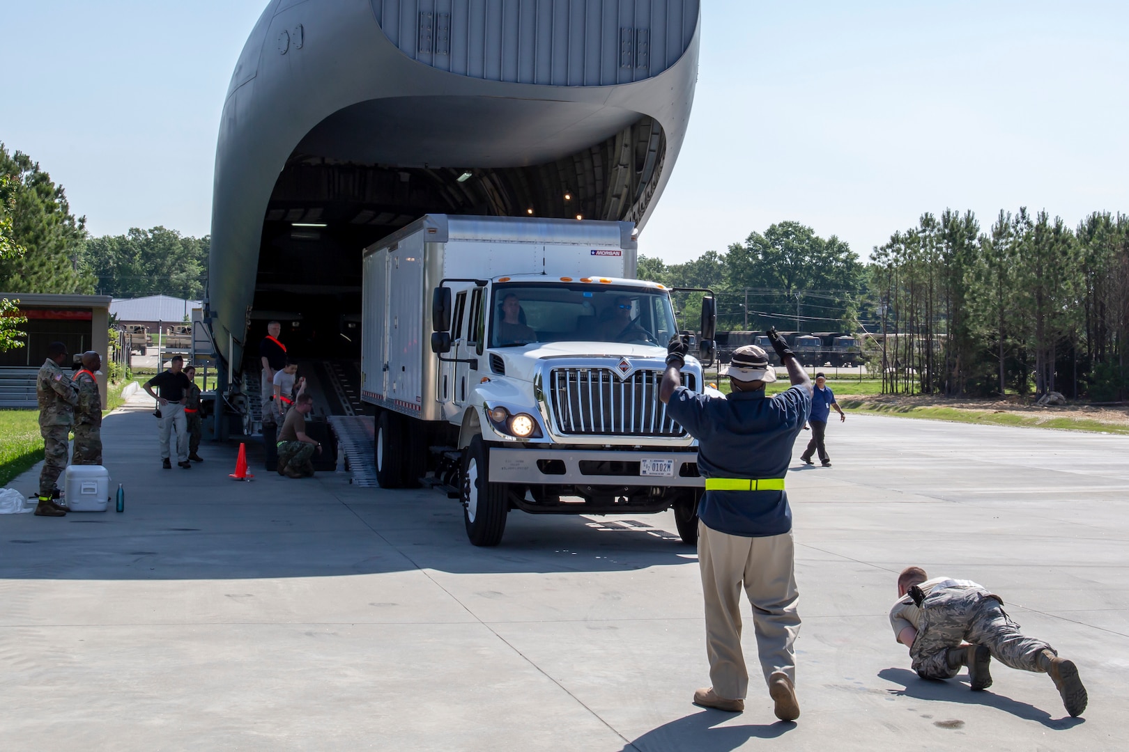 Members of Joint Task Force Civil Support (JTF-CS) participate in a two-day training exercise loading and unloading vehicles on a modified Boeing C-17 Globemaster III. The exercise helped members build the confidence and skills necessary to safely and successfully deploy. JTF-CS provides command and control for designated Department of Defense specialized response forces to assist local, state, federal and tribal partners in saving lives, preventing further injury, and providing critical support to enable community recovery. (Official Department of Defense photo by Mass Communication Specialist 3rd Class Michael Redd/released)