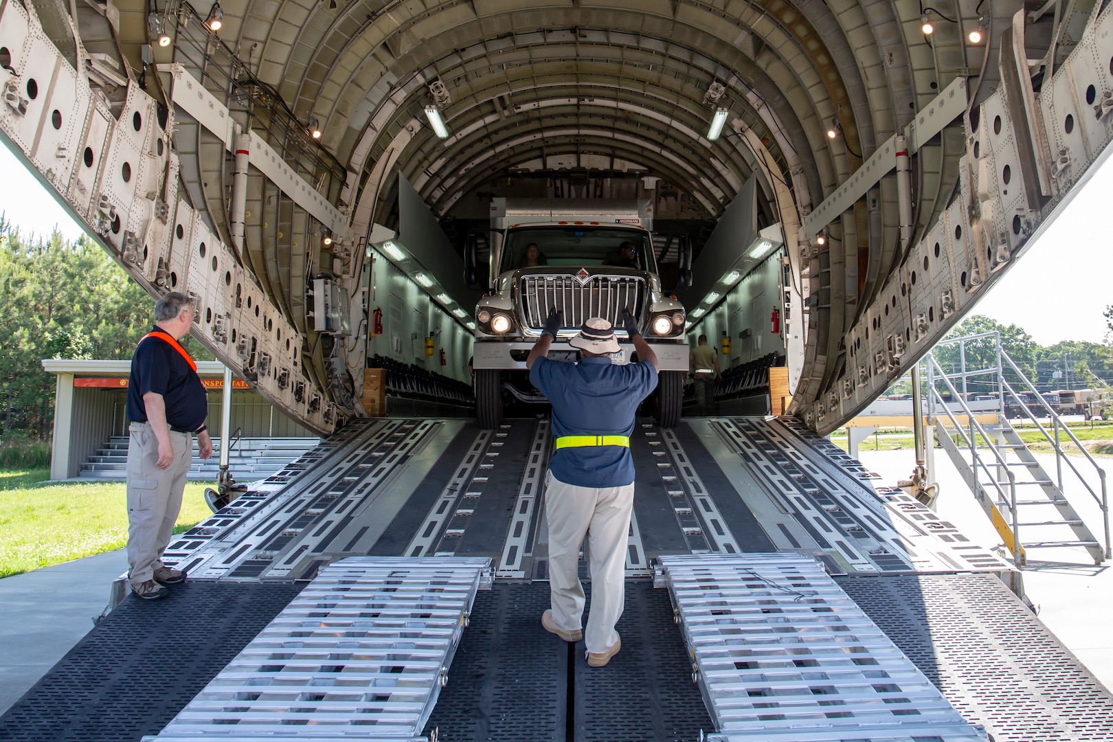 Members of Joint Task Force Civil Support (JTF-CS) participate in a two-day training exercise loading and unloading vehicles on a modified Boeing C-17 Globemaster III. The exercise helped members build the confidence and skills necessary to safely and successfully deploy. JTF-CS provides command and control for designated Department of Defense specialized response forces to assist local, state, federal and tribal partners in saving lives, preventing further injury, and providing critical support to enable community recovery. (Official Department of Defense photo by Mass Communication Specialist 3rd Class Michael Redd/released)
