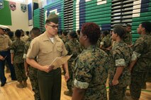 Marines and Sailors with Chemical Biological Incident Response Force, U.S. Marine Corps Forces Command, volunteered their time to conduct a JROTC uniform inspection at St. Charles High School in Waldorf, Md., April 18, 2018. During the inspection the Marines and sailors looked over the students’ uniforms, tested their military knowledge and shared their expertise with the high school students. (Official USMC Photos by Staff Sgt. Santiago G. Colon Jr.)