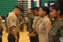 Marines and Sailors with Chemical Biological Incident Response Force, U.S. Marine Corps Forces Command, volunteered their time to conduct a JROTC uniform inspection at St. Charles High School in Waldorf, Md., April 18, 2018. During the inspection the Marines and sailors looked over the students’ uniforms, tested their military knowledge and shared their expertise with the high school students. (Official USMC Photos by Staff Sgt. Santiago G. Colon Jr.)