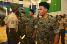 Marines and Sailors with Chemical Biological Incident Response Force, U.S. Marine Corps Forces Command, volunteered their time to conduct a JROTC uniform inspection at St. Charles High School in Waldorf, Md., April 18, 2018. During the inspection the Marines and sailors looked over the students’ uniforms, tested their military knowledge and shared their expertise with the high school students. (Official USMC Photos by Staff Sgt. Santiago G. Colon Jr.)