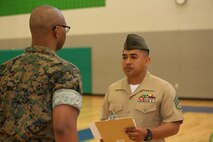 Marines and Sailors with Chemical Biological Incident Response Force, U.S. Marine Corps Forces Command, volunteered their time to conduct a JROTC uniform inspection at St. Charles High School in Waldorf, Md., April 18, 2018. During the inspection the Marines and sailors looked over the students’ uniforms, tested their military knowledge and shared their expertise with the high school students. (Official USMC Photos by Staff Sgt. Santiago G. Colon Jr.)
