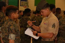 Marines and Sailors with Chemical Biological Incident Response Force, U.S. Marine Corps Forces Command, volunteered their time to conduct a JROTC uniform inspection at St. Charles High School in Waldorf, Md., April 18, 2018. During the inspection the Marines and sailors looked over the students’ uniforms, tested their military knowledge and shared their expertise with the high school students. (Official USMC Photos by Staff Sgt. Santiago G. Colon Jr.)