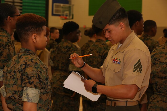 Marines and Sailors with Chemical Biological Incident Response Force, U.S. Marine Corps Forces Command, volunteered their time to conduct a JROTC uniform inspection at St. Charles High School in Waldorf, Md., April 18, 2018. During the inspection the Marines and sailors looked over the students’ uniforms, tested their military knowledge and shared their expertise with the high school students. (Official USMC Photos by Staff Sgt. Santiago G. Colon Jr.)