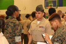 Marines and Sailors with Chemical Biological Incident Response Force, U.S. Marine Corps Forces Command, volunteered their time to conduct a JROTC uniform inspection at St. Charles High School in Waldorf, Md., April 18, 2018. During the inspection the Marines and sailors looked over the students’ uniforms, tested their military knowledge and shared their expertise with the high school students. (Official USMC Photos by Staff Sgt. Santiago G. Colon Jr.)