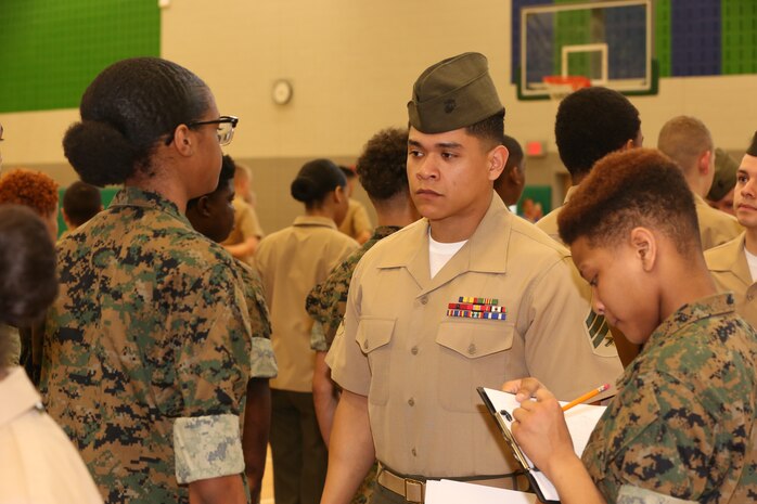 Marines and Sailors with Chemical Biological Incident Response Force, U.S. Marine Corps Forces Command, volunteered their time to conduct a JROTC uniform inspection at St. Charles High School in Waldorf, Md., April 18, 2018. During the inspection the Marines and sailors looked over the students’ uniforms, tested their military knowledge and shared their expertise with the high school students. (Official USMC Photos by Staff Sgt. Santiago G. Colon Jr.)