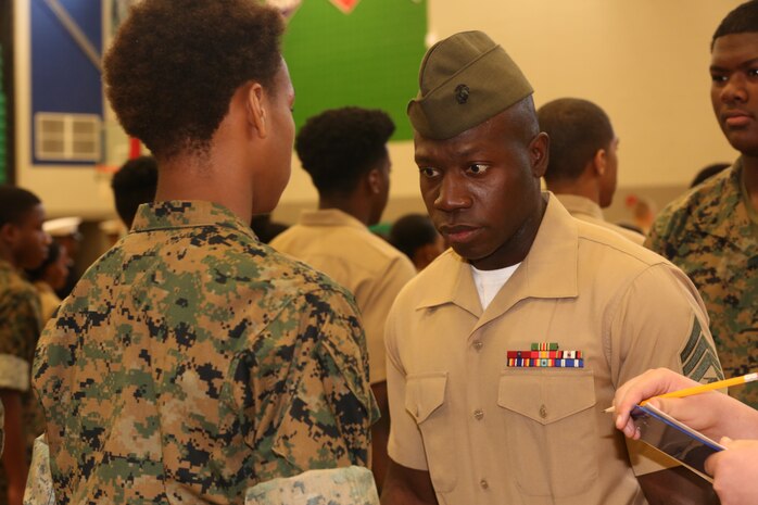 Marines and Sailors with Chemical Biological Incident Response Force, U.S. Marine Corps Forces Command, volunteered their time to conduct a JROTC uniform inspection at St. Charles High School in Waldorf, Md., April 18, 2018. During the inspection the Marines and sailors looked over the students’ uniforms, tested their military knowledge and shared their expertise with the high school students. (Official USMC Photos by Staff Sgt. Santiago G. Colon Jr.)