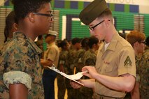 Marines and Sailors with Chemical Biological Incident Response Force, U.S. Marine Corps Forces Command, volunteered their time to conduct a JROTC uniform inspection at St. Charles High School in Waldorf, Md., April 18, 2018. During the inspection the Marines and sailors looked over the students’ uniforms, tested their military knowledge and shared their expertise with the high school students. (Official USMC Photos by Staff Sgt. Santiago G. Colon Jr.)